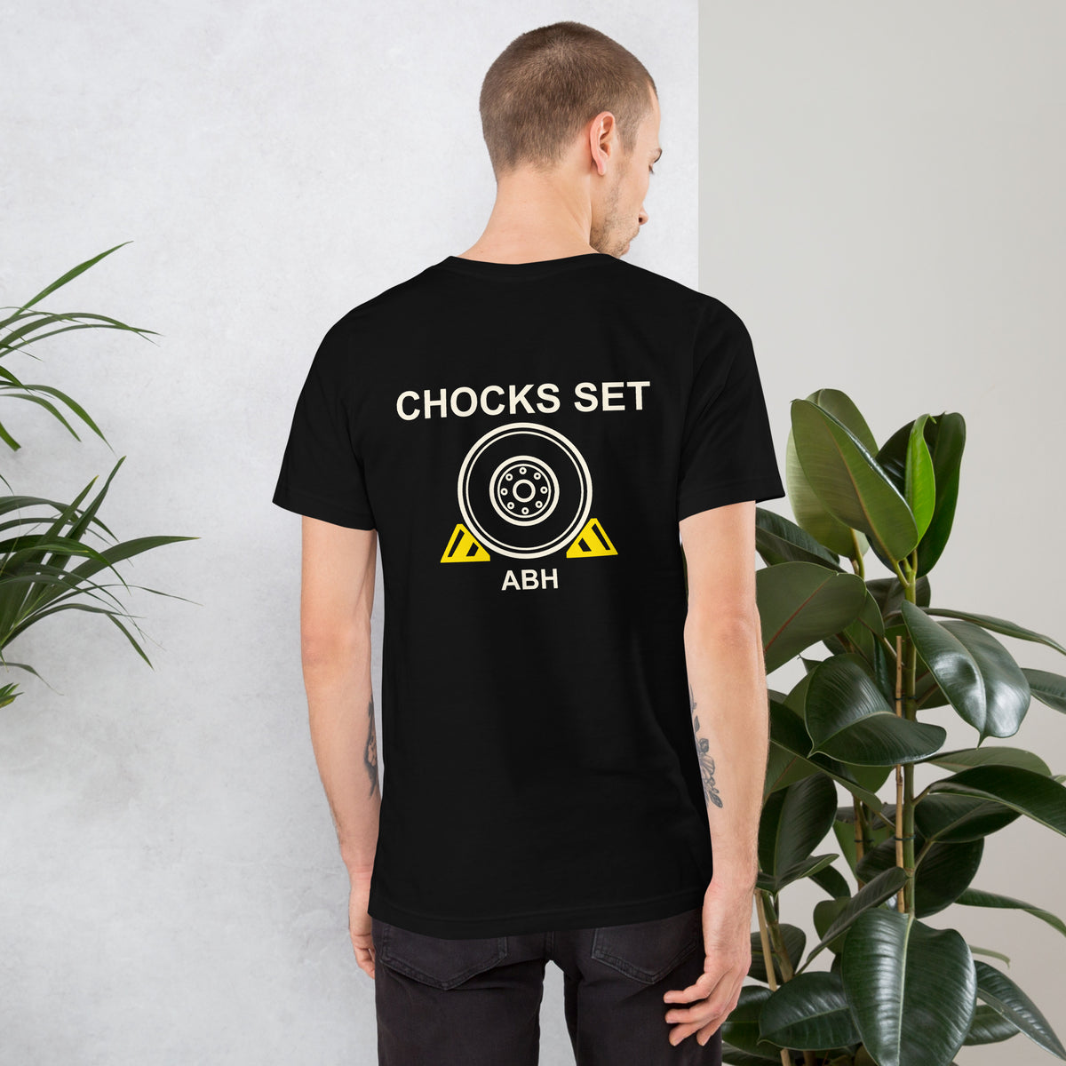Black ABH Chocks Set T-shirt back with aircraft wheel and yellow flight deck chocks graphic